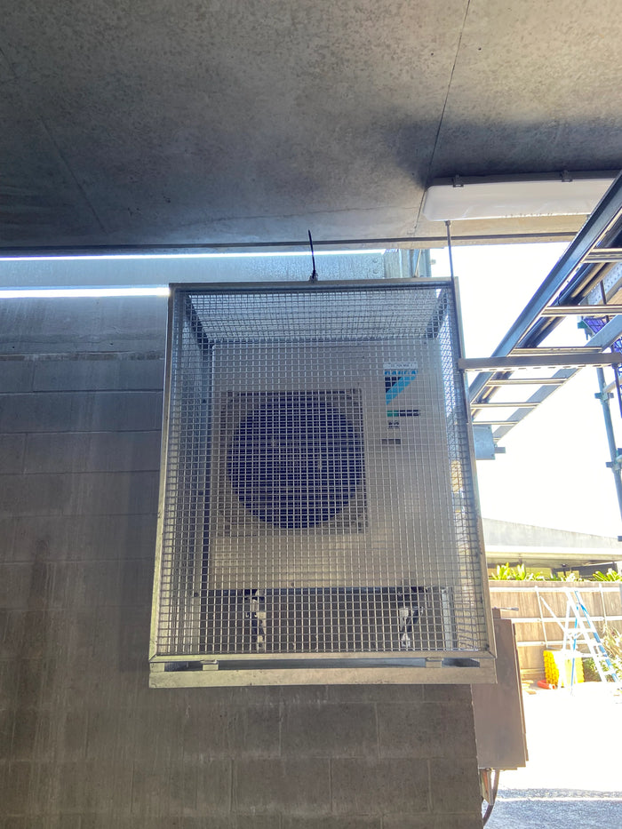 Steel condenser cage with bottom panel